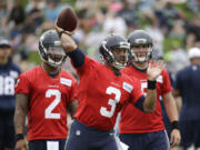 Seattle Seahawks quarterback Russell Wilson throws during the team&#039;s NFL football training camp Saturday, July 30, 2016, in Renton, Wash.