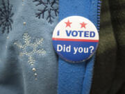 A voter wears an &quot;I Voted&quot; pin at Gaiser Hall, Clark College, in Vancouver on Nov. 3.