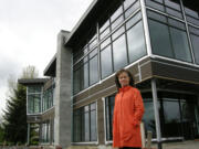 Kimberly Sherertz, widow of the late Vancouver businessman William Sherertz, stands in 2011 beside the unfinished waterfront restaurant that her husband had planned to open as The Black Pearl overlooking the marina at the Port of Camas-Washougal. The building is now for sale, allowing the Pearl to be passed to a hopeful restaurateur or other developer.