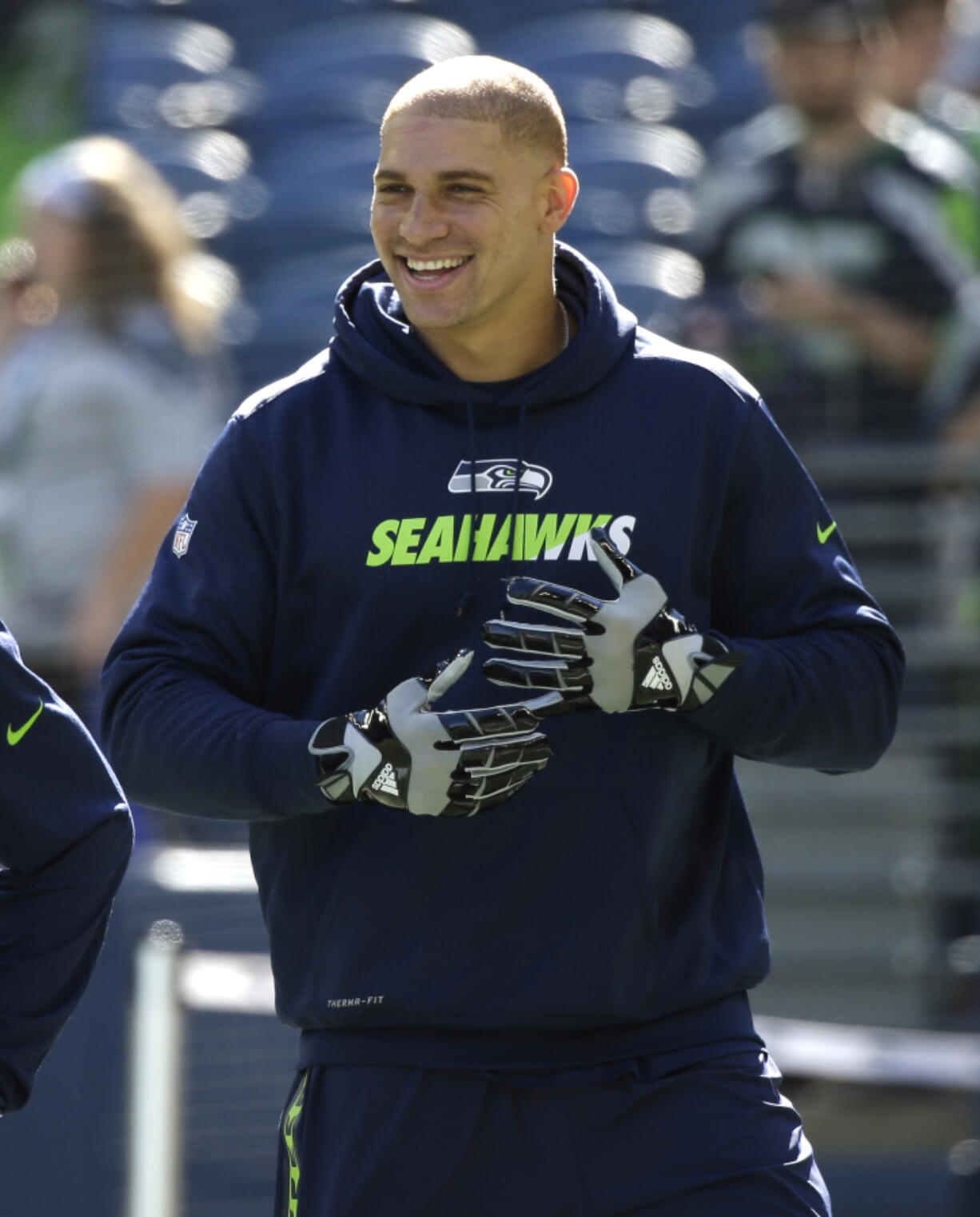 Seattle Seahawks tight end Jimmy Graham smiles as he stands on the field during warmups before an NFL football game against the Chicago Bears, Sunday, Sept. 27, 2015, in Seattle.