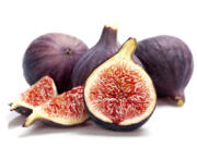 Sliced ripe figs on white background