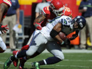 Seattle Seahawks wide receiver Doug Baldwin (89) is tackled by Kansas City Chiefs defensive back Steven Nelson (20) during the first half of an NFL preseason football game in Kansas City, Mo., Saturday, Aug. 13, 2016.