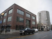 A motorist passes the new Hudson building in January in downtown Vancouver.