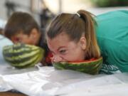 Danielle Gawronski, 14, of La Center competes in the watermelon eating contest at the Clark County Fair. Gawronski took third place.