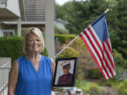 Susie Ehle, daughter of Medal of Honor recipient Robert Bush, at her Lake Shore-area home with the only photo he had taken in a Marine uniform. The Navy medical corpsman was assigned to a Marine rifle company on Okinawa.