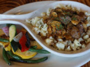 Beef tenderloin tips and sauteed mushrooms are served over a bed of roasted cauliflower, topped with a house-made brown gravy and accented with seasonal vegetables.