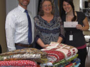 Bagley Downs: Just For Fun Quilting donated $1,000 to the Children&#039;s Justice Center after raising the money during the Western Washington Quilt Shop Hop in June.