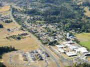 An aerial photo shows residential development along Hillhurst Road near Ridgefield High School.