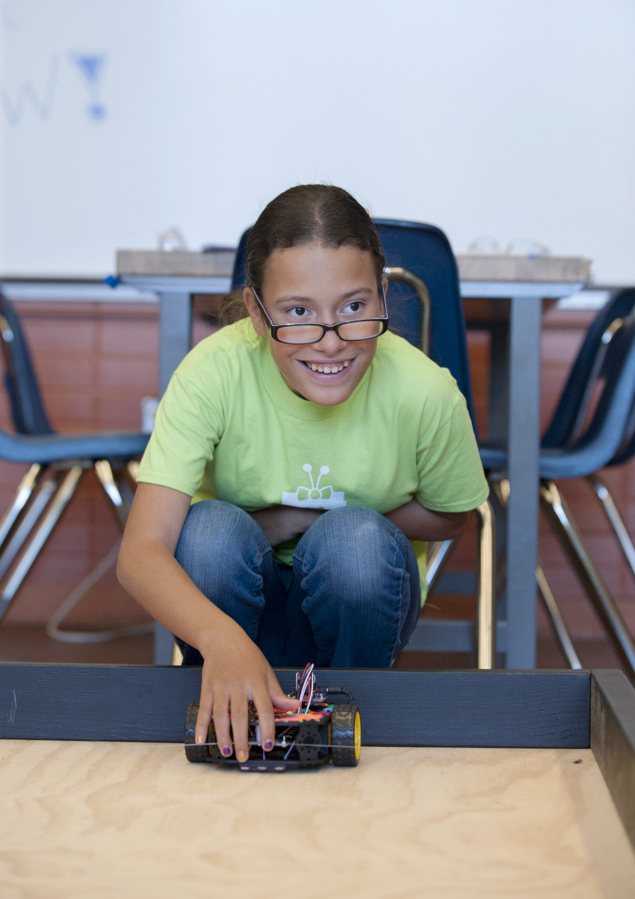 Gemini Baltzegar, 13, tests her robot.