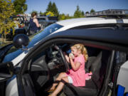 Four-year-old Kinley Goertler from Camas gets hands-on with the inside of a Vancouver Police Department patrol car during a recruitment event for girls curious about careers in law enforcement last year at the Vancouver Police East Precinct.