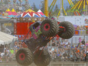 The Wild Orchid monster truck performs for the crowd on the final day of the Clark County Fair in 2014.