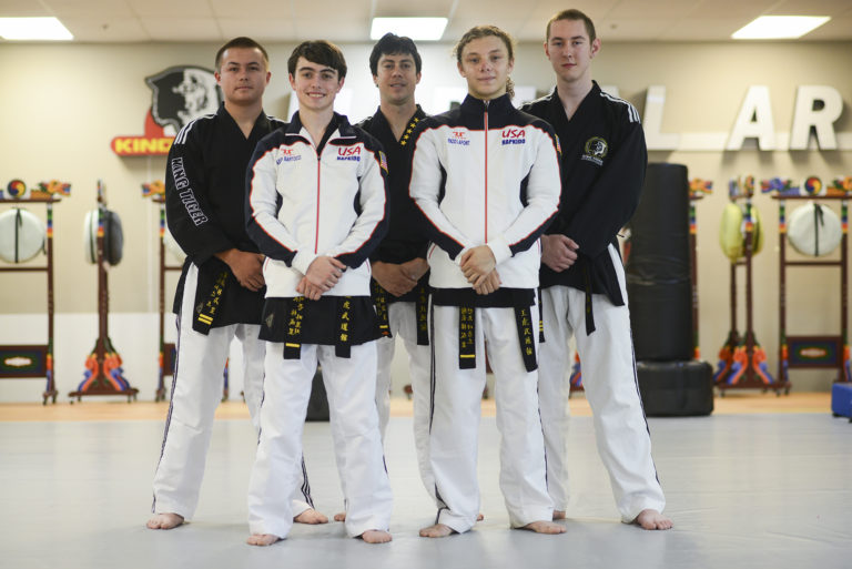 Seventeen-year-old Aiden Bartocci, front left, and sixteen-year-old Enzo LaFont, front right, take a break from practice with their classmates during practice at King Tiger Martial Arts in Vancouver, Tuesday August 23, 2016. Bartocci and LaFont are going to South Korea in September to represent the USA at the first World Martial Arts Mastership.