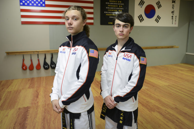 Sixteen-year-old Enzo LaFont, left, and seventeen-year-old Aiden Bartocci, right, take a break during practice at King Tiger Martial Arts in Vancouver, Tuesday August 23, 2016. The Vancouver teens are going to South Korea in September to represent the USA at the first World Martial Arts Mastership.