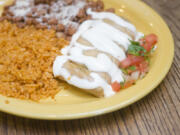 Sabor Mexicano&#039;s homemade tamale plate is served July 30 at the restaurant in Vancouver&#039;s Uptown Village area. The business started out selling tamales at the Vancouver Farmers Market.