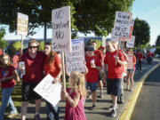 Teachers and community members picket Friday at Evergreen High School amid contract negotiations.