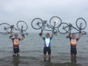 Ridgefield: Nigel Hall, from left, Josh Bean and Matt Gaylor, a Skyview High School graduate, in the Atlantic Ocean in Boston after concluding a bike ride across the country where they raised more than $24,000 for young people dealing with cancer.