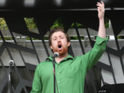 Zachary Lenox of the Portland Opera sings &quot;Toreador&quot; from &quot;Carmen&quot; during an Opera a la Cart performance at the Vancouver Farmers Market on Saturday. Opera a la Cart, a mobile venue, is a play on the Pacific Northwest&#039;s food truck scene.