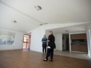 Debby Dover, executive director of Second Step Housing, left, looks over the living area of the largest unit at Horizon Place with Denise Stone, director of programs and asset management.