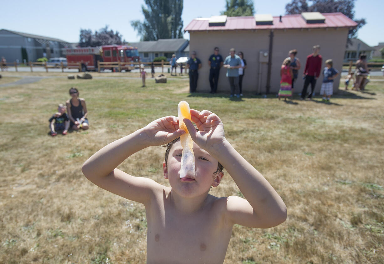 Jason Burden, 5, of Camas beats the heat with a cold treat Aug. 18 at Bill Hamllick Park in Washougal.