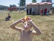 Jason Burden, 5, of Camas beats the heat with a cold treat Aug. 18 at Bill Hamllick Park in Washougal.