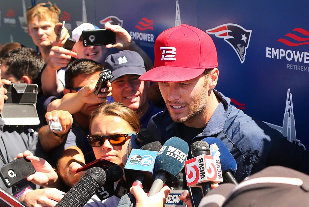 New England Patriots quarterback Tom Brady speaks to media at football training camp, Friday, Aug. 5, 2016, in Foxborough, Mass. Brady said his decision not to pursue his appeal of a four-game suspension in the "Deflategate" saga was "a personal decision." The four-time Super Bowl winner spoke for the first time Friday at New England's training camp. He is allowed to practice with the team and play in the Patriots' preseason games, but will miss the first four regular-season games.