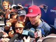 New England Patriots quarterback Tom Brady speaks to media at football training camp, Friday, Aug. 5, 2016, in Foxborough, Mass. Brady said his decision not to pursue his appeal of a four-game suspension in the "Deflategate" saga was "a personal decision." The four-time Super Bowl winner spoke for the first time Friday at New England's training camp. He is allowed to practice with the team and play in the Patriots' preseason games, but will miss the first four regular-season games.