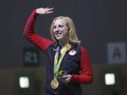 Virginia Thrasher of the United States waves after she received the gold medal for the Women's 10m Air Rifle competition at Olympic Shooting Center at the 2016 Summer Olympics in Rio de Janeiro, Brazil, Saturday, Aug. 6, 2016.