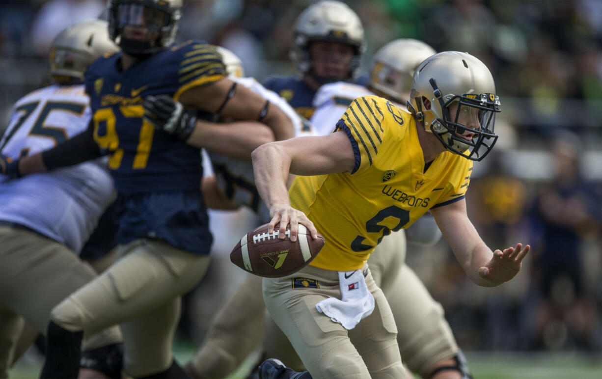 Quarterback Dakota Prukop scrambles with the football during the Oregon Spring Game in Eugene, Ore. He was named the Ducks' starting quarterback on Friday, Aug. 26, 2017.