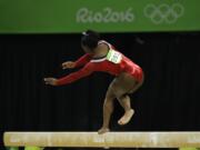 United States' Simone Biles stumbles during her performance on the balance beam during the artistic gymnastics women's apparatus final at the 2016 Summer Olympics in Rio de Janeiro, Brazil, Monday, Aug. 15, 2016.