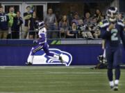 Minnesota Vikings cornerback Marcus Sherels, left, scores the go-ahead touchdown after he intercepted a pass from Seattle Seahawks quarterback Trevone Boykin, right, during the second half of a preseason NFL football game, Thursday, Aug. 18, 2016, in Seattle. The Vikings won 18-11.