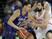 United States' Klay Thompson (11) drives past Spain's Sergio Llull, right, during a semifinal round basketball game at the 2016 Summer Olympics in Rio de Janeiro, Brazil, Friday, Aug. 19, 2016.