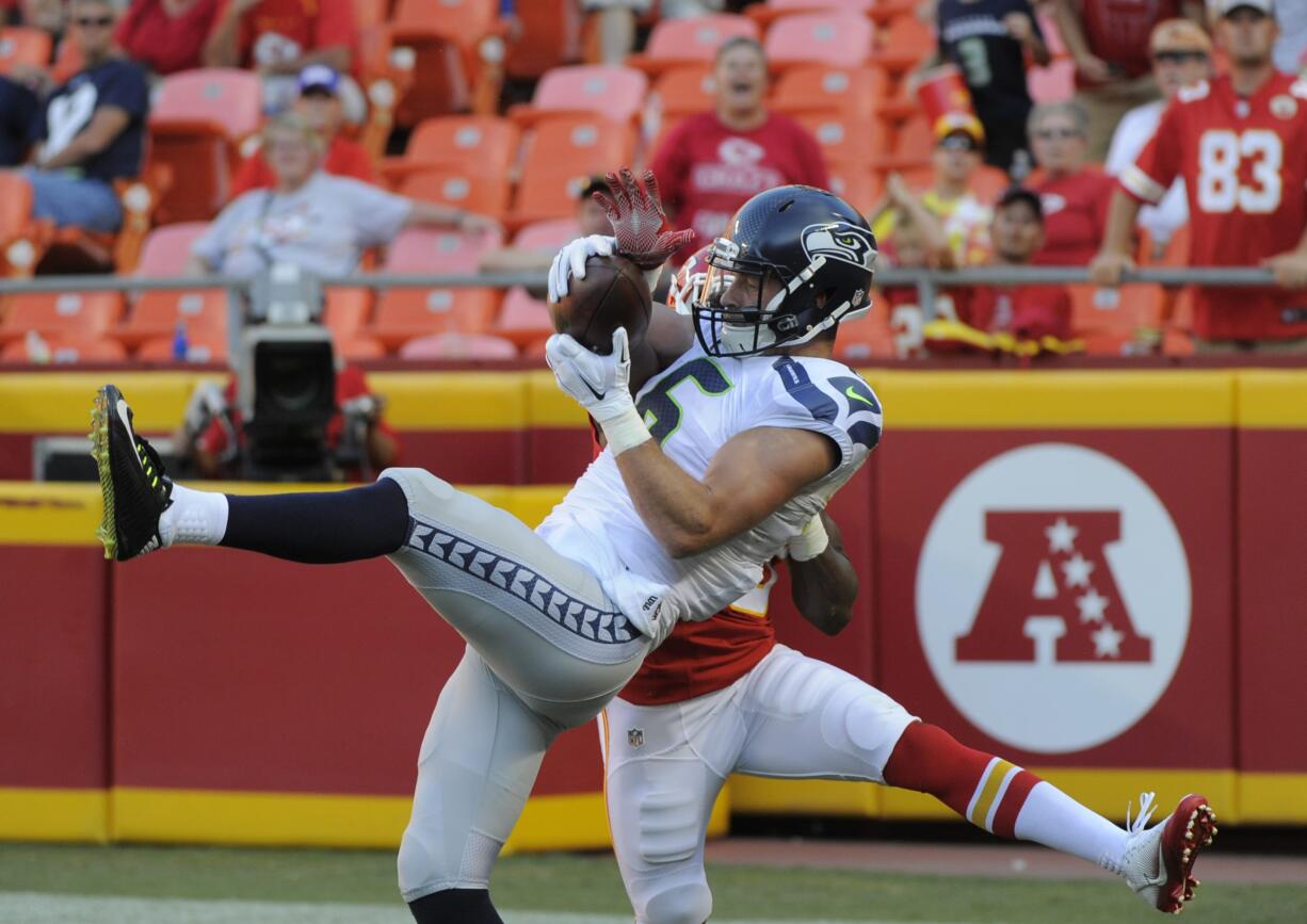 Seattle Seahawks defensive back Tanner McEvoy, front, makes a touchdown catch in the end zone in front of Kansas City Chiefs defensive back Malcolm Jackson, during the second half of an NFL preseason football game in Kansas City, Mo., Saturday, Aug. 13, 2016. The Seattle Seahawks won 17-16.