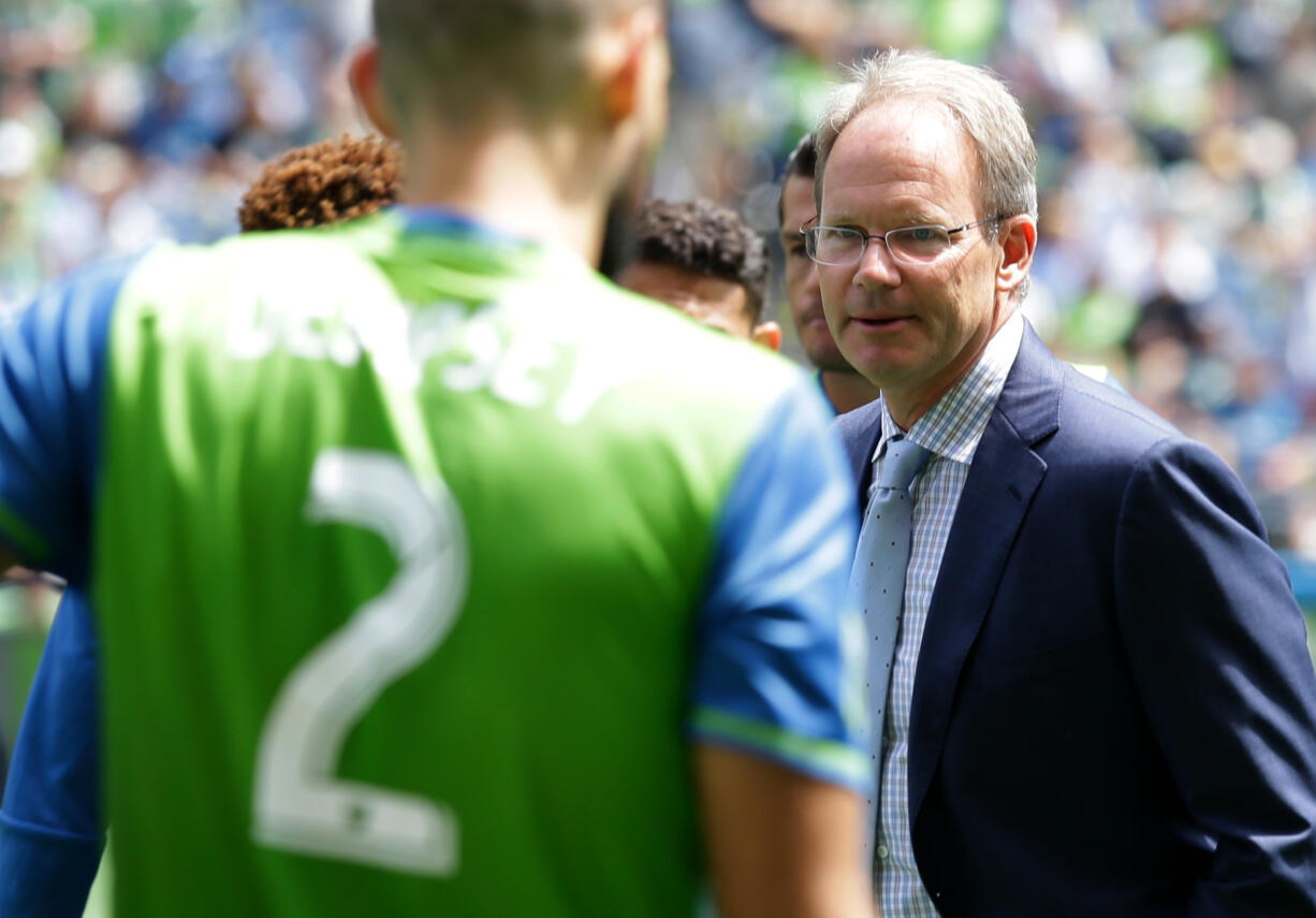 Seattle Sounders interim head coach Brian Schmetzer, right, looks towards midfielder Clint Dempsey (2) during a team huddle before an MLS soccer match against the Los Angeles Galaxy, Sunday, July 31, 2016, in Seattle. (AP Photo/Ted S.