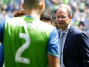 Seattle Sounders interim head coach Brian Schmetzer, right, looks towards midfielder Clint Dempsey (2) during a team huddle before an MLS soccer match against the Los Angeles Galaxy, Sunday, July 31, 2016, in Seattle. (AP Photo/Ted S.
