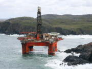 The Transocean Winner drilling rig is seen off the coast of the Isle of Lewis, Scotland, after it ran aground in severe weather conditions Tuesday.  The oil rig, carrying 280 tonnes of diesel, broke free of its tug and ran aground on the remote Scottish beach where it is being monitored by a counter-pollution team.