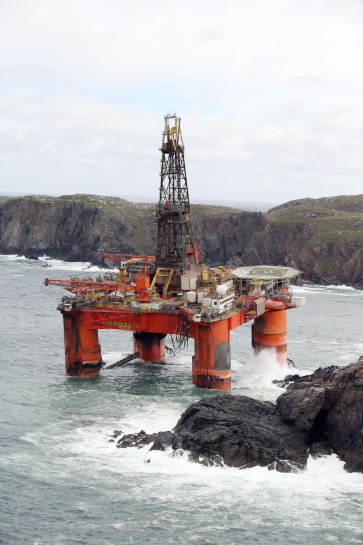 The Transocean Winner drilling rig is seen off the coast of the Isle of Lewis, Scotland, on Tuesday  after it ran aground in severe weather conditions. The oil rig, carrying 280 tonnes of diesel, broke free of its tug and ran aground on the remote Scottish beach where it is being monitored by a counter-pollution team.