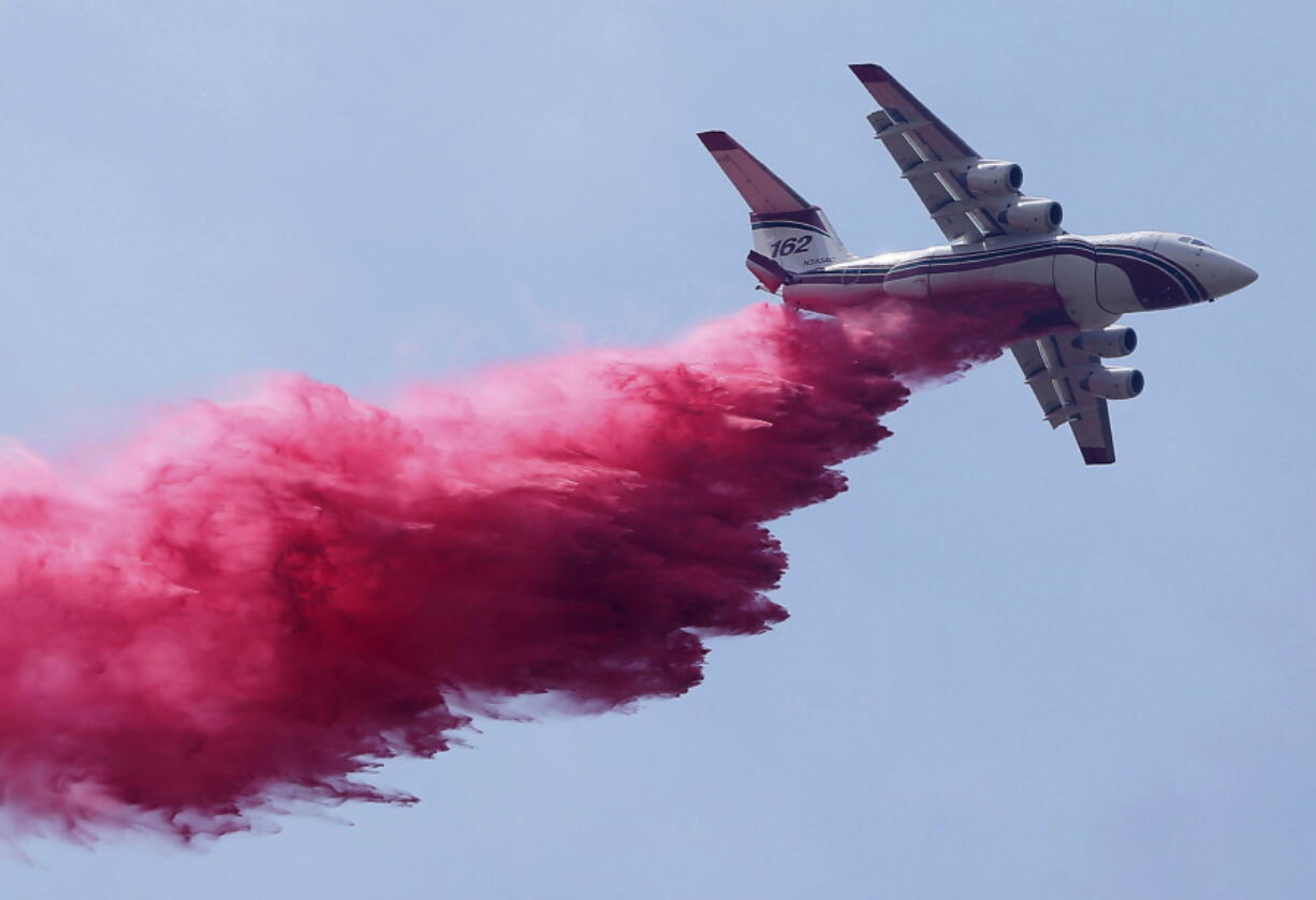 An air tanker makes a fire retardant drop Friday, Aug. 19, 2016 on the Lebec Fire off Interstate 5 in Lebec, Calif. Firefighters kept the blaze to 10 acres.