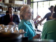 Democratic presidential candidate Hillary Clinton visits with patrons and supporters at Hub Coffee Roasters in Reno, Nev., on Thursday.