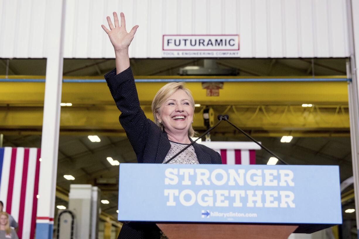 Democratic presidential candidate Hillary Clinton waves as she finishes a speech on the economy after touring Futuramic Tool &amp; Engineering, in Warren, Mich., Thursday, Aug. 11, 2016.