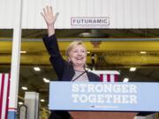 Democratic presidential candidate Hillary Clinton waves as she finishes a speech on the economy after touring Futuramic Tool &amp; Engineering, in Warren, Mich., Thursday, Aug. 11, 2016.