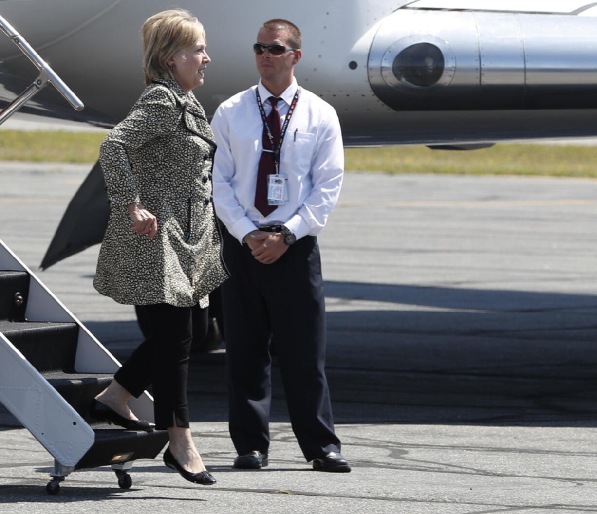 Democratic presidential candidate Hillary Clinton steps from her campaign plane as she arrives at Nantucket Memorial Airport in Nantucket, Mass., on Saturday en route to a fundraiser.