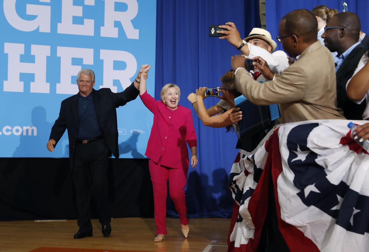 Democratic presidential candidate Hillary Clinton and Rep. Robert Brady, D-Pa., arrive at a Pennsylvania Democratic Party voter registration event at West Philadelphia High School in Philadelphia, Tuesday, Aug. 16, 2016.