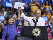 Democratic presidential candidate Hillary Clinton and Vice President Joe Biden hold hands in the air during a campaign rally, Monday, Aug. 15, 2016, in Scranton, Pa.