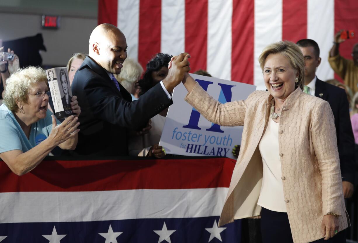 Democratic presidential candidate Hillary Clinton is greeted as she arrives at a campaign event at John Marshall High School in Cleveland, Wednesday, Aug. 17, 2016.