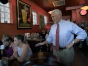 Republican vice presidential candidate, Indiana Gov. Mike Pence, right, surprises patrons at Millie&#039;s Diner in Richmond, Va. Saturday, Aug. 27, 2016, during an impromptu visit by the candidate to the popular restaurant.