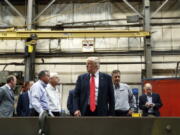 Republican presidential candidate Donald Trump tours McLanahan Corporation, a manufacturer of mineral and agricultural equipment in Hollidaysburg, Pa., on Friday.