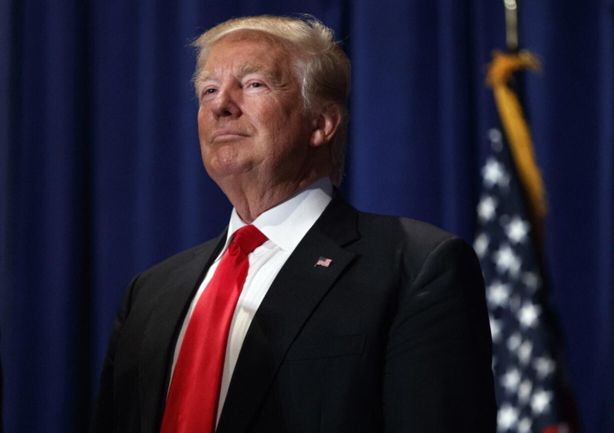 Republican presidential candidate Donald Trump pauses during a campaign rally in Altoona, Pa.