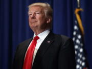 Republican presidential candidate Donald Trump pauses during a campaign rally in Altoona, Pa.