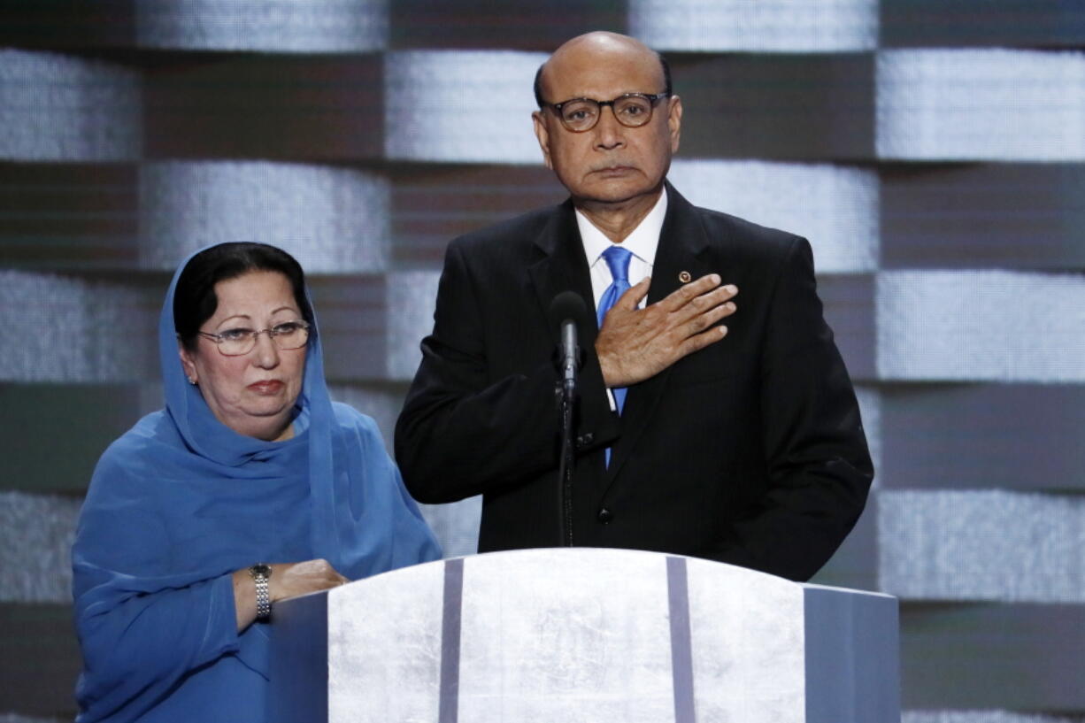 Khizr Khan, father of fallen US Army Capt. Humayun S. M. Khan and his wife, Ghazala, speak during the final day of the Democratic National Convention in Philadelphia. Republican presidential nominee Donald Trump broke a major American political and societal taboo over the weekend when he engaged in an emotionally-charged feud with Khizr and Ghazala Khan, the bereaved parents of a decorated Muslim Army captain killed by a suicide bomber in Iraq. He further stoked outrage by implying Ghazala Khan did not speak while standing alongside her husband at last week&#039;s Democratic convention because they are Muslim. (AP Photo/J.