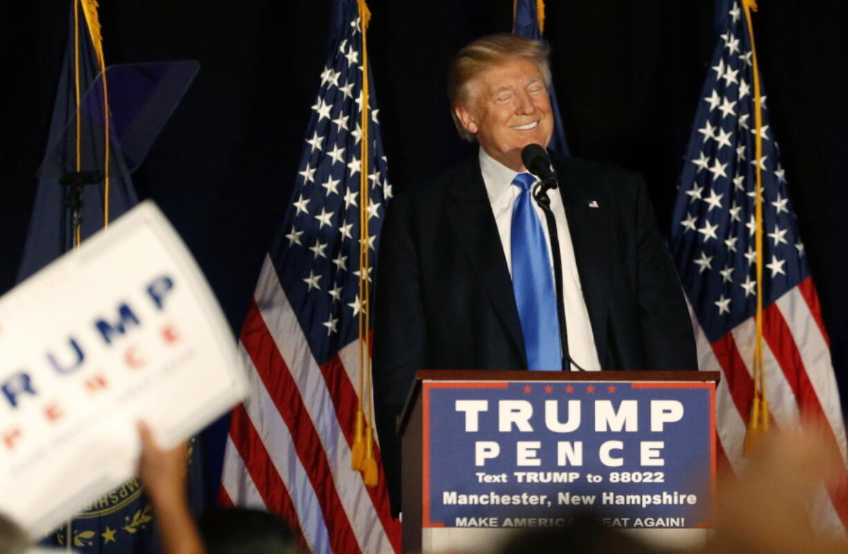 Republican presidential candidate Donald Trump smiles while speaking at a campaign rally in Manchester, N.H., on Thursday.